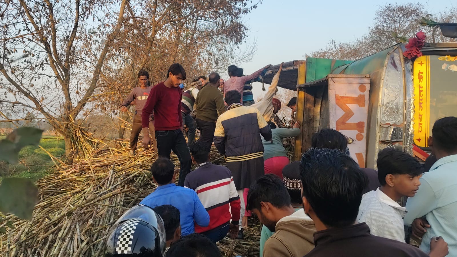 Sugarcane loaded truck overturns on car on Pilibhit highway several feared trapped