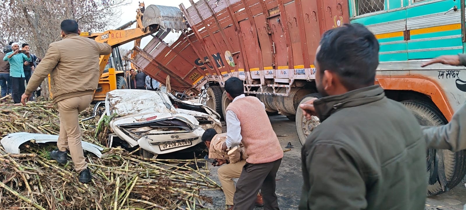 Sugarcane overloaded truck overturns on car police officer recovers safely after an hour