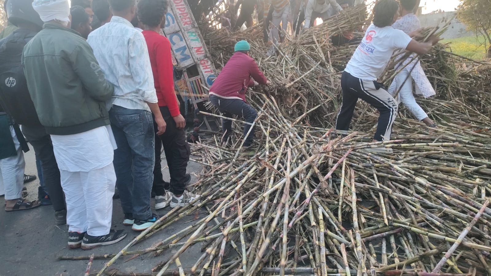 Sugarcane loaded truck overturns on car on Pilibhit highway several feared trapped