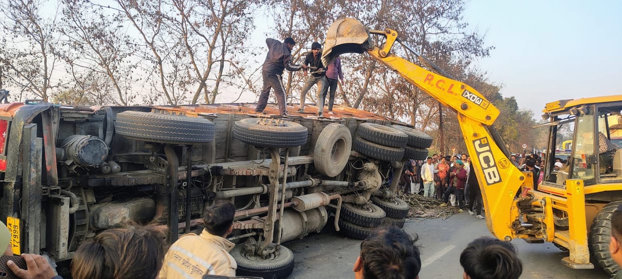 Sugarcane loaded truck overturns on car on Pilibhit highway several feared trapped