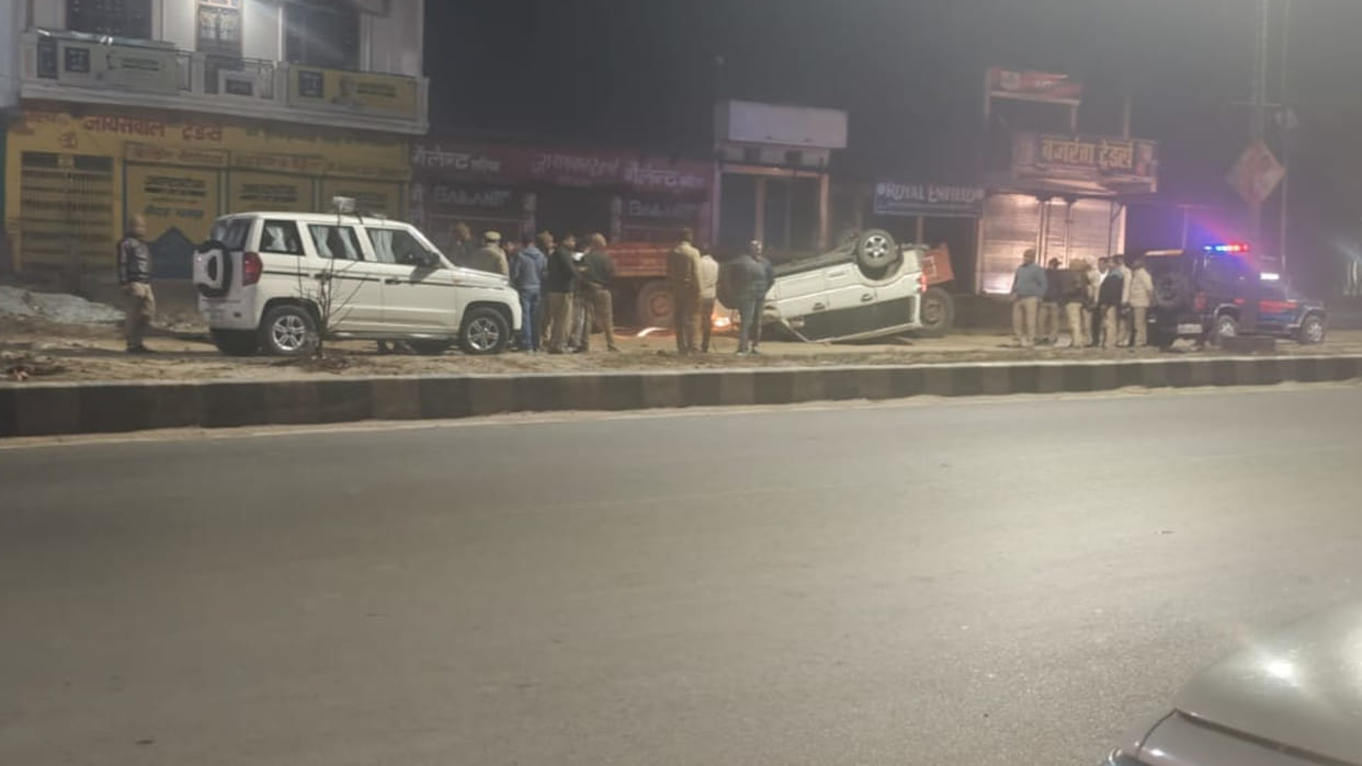 Two people died when a Scorpio car, trying to escape a police cordon, overturned in Gauri Bazaar in Gorakhpur.