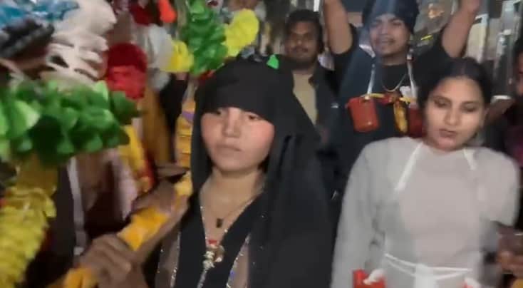 Muslim woman embarks on 100-km Kanwar Yatra carrying Kanwar in burqa with live-in partner