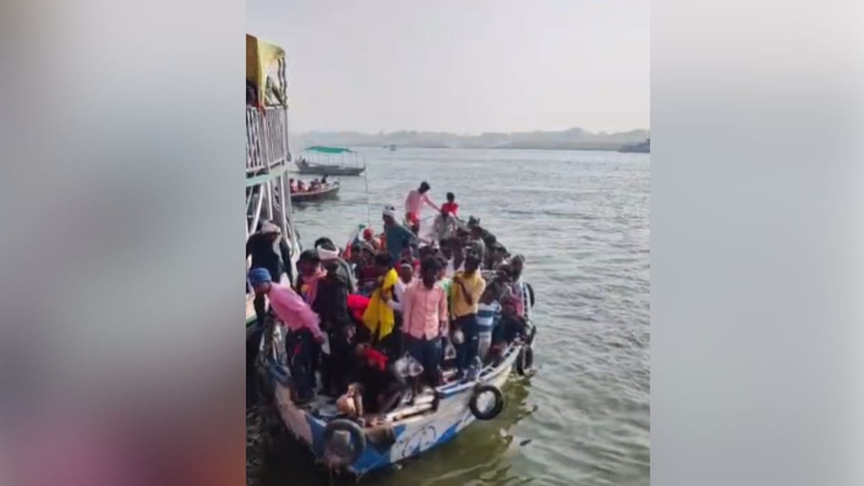 Passengers board boats without life jackets at the Ganga Ghats in Varanasi