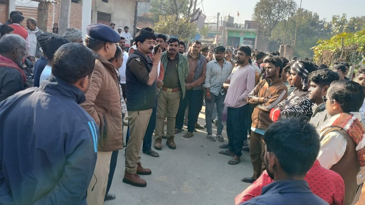 young man was hacked to death with an axe inside his house in Jhunsi, and the accused dumped the body in front