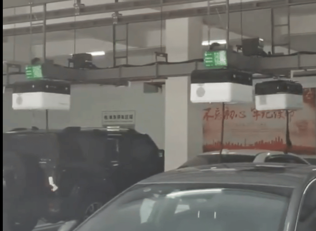 Forget Charging Hassles, Roof-Mounted Robot Find and Charge Your EV Parking Lot