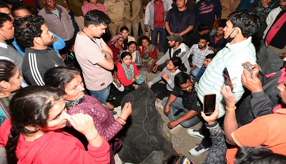 People blocked the road after two women died in a tiger attack