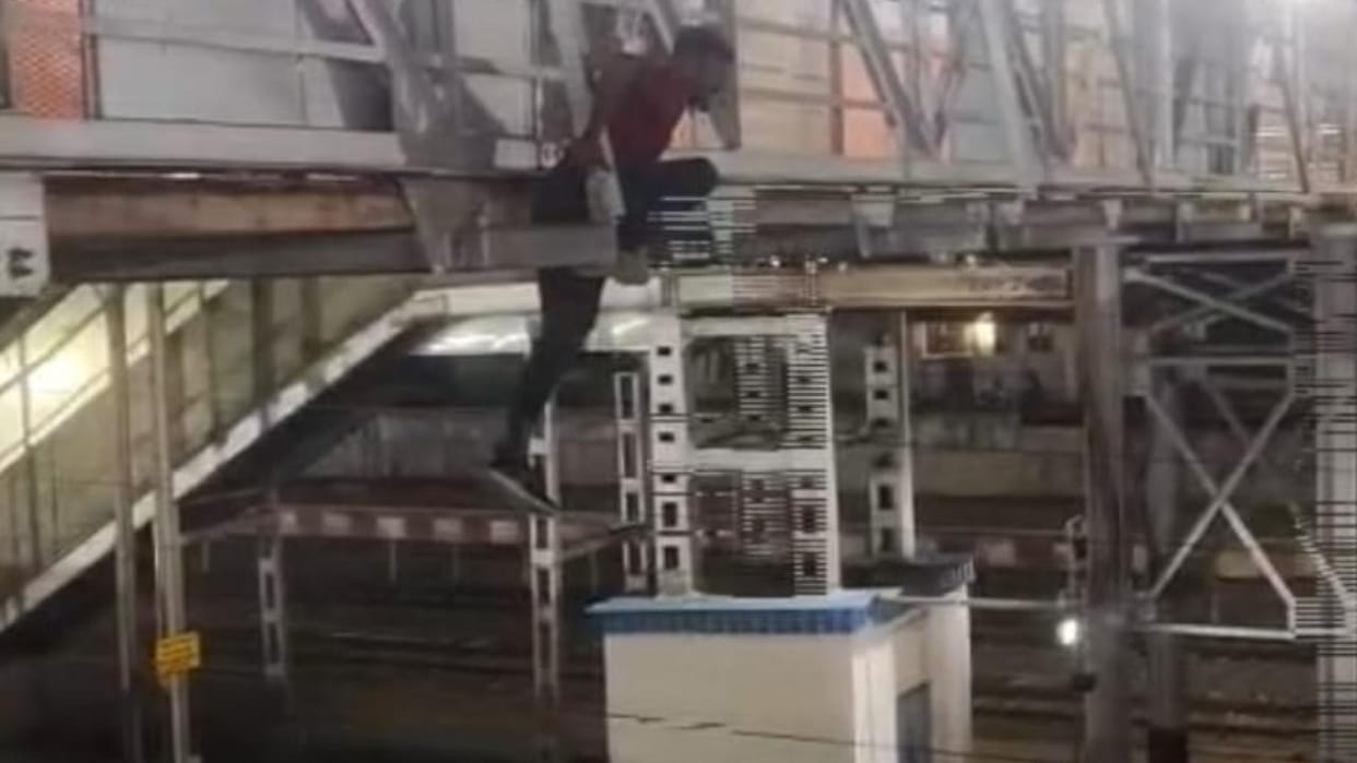 Lalitpur: A young man created a ruckus by hanging from a bridge at the railway station, jumped onto the tracks