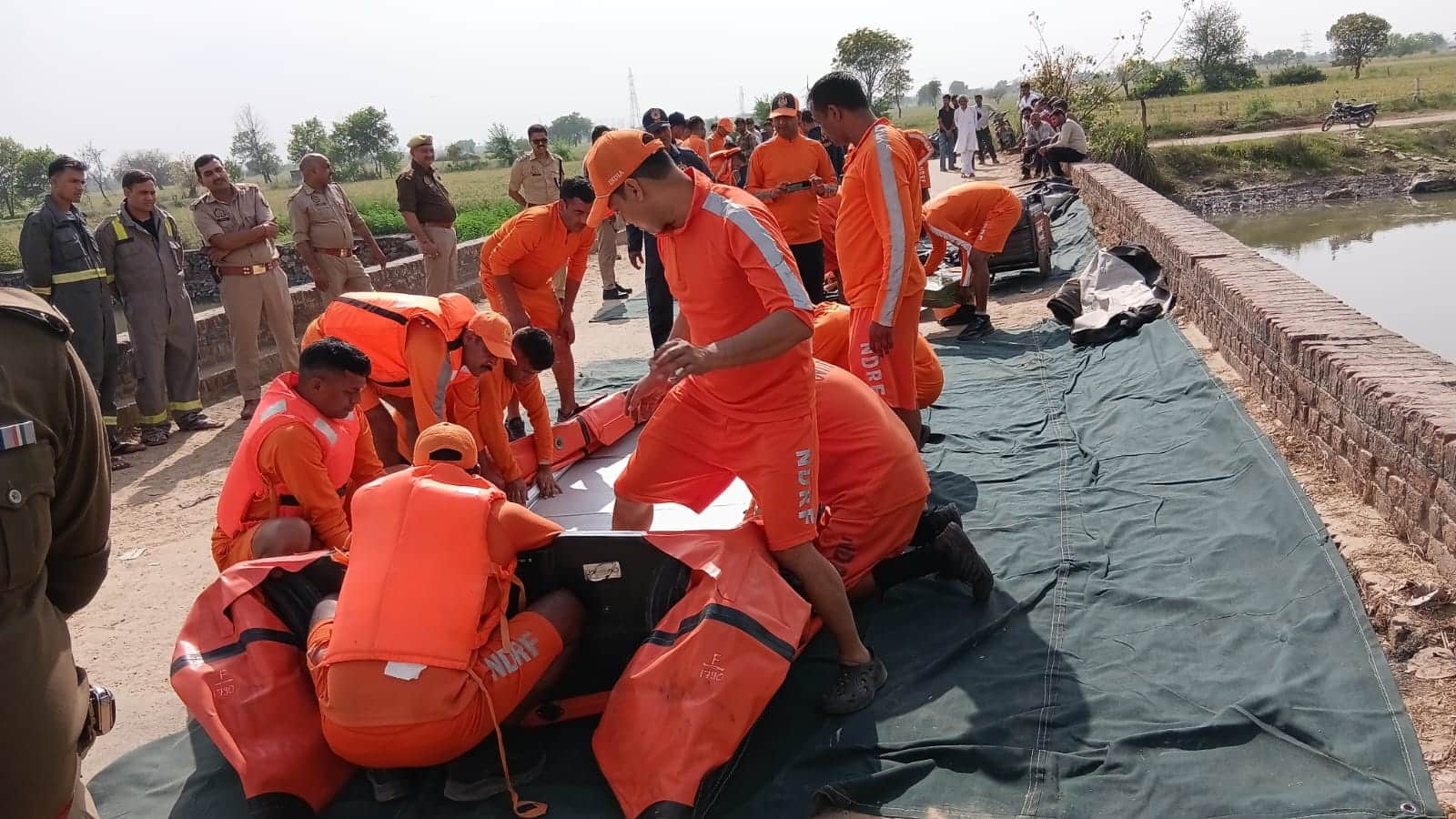 car hit a couple riding bike and fell into canal In Bulandshahr
