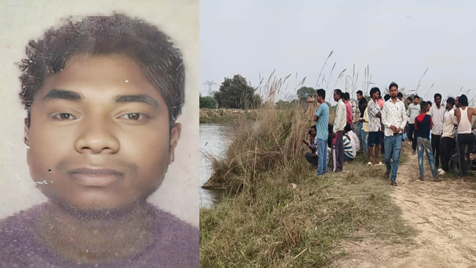 नहर में मजदूर की तलाश करते गोताखोर व मौजूद पुलिस