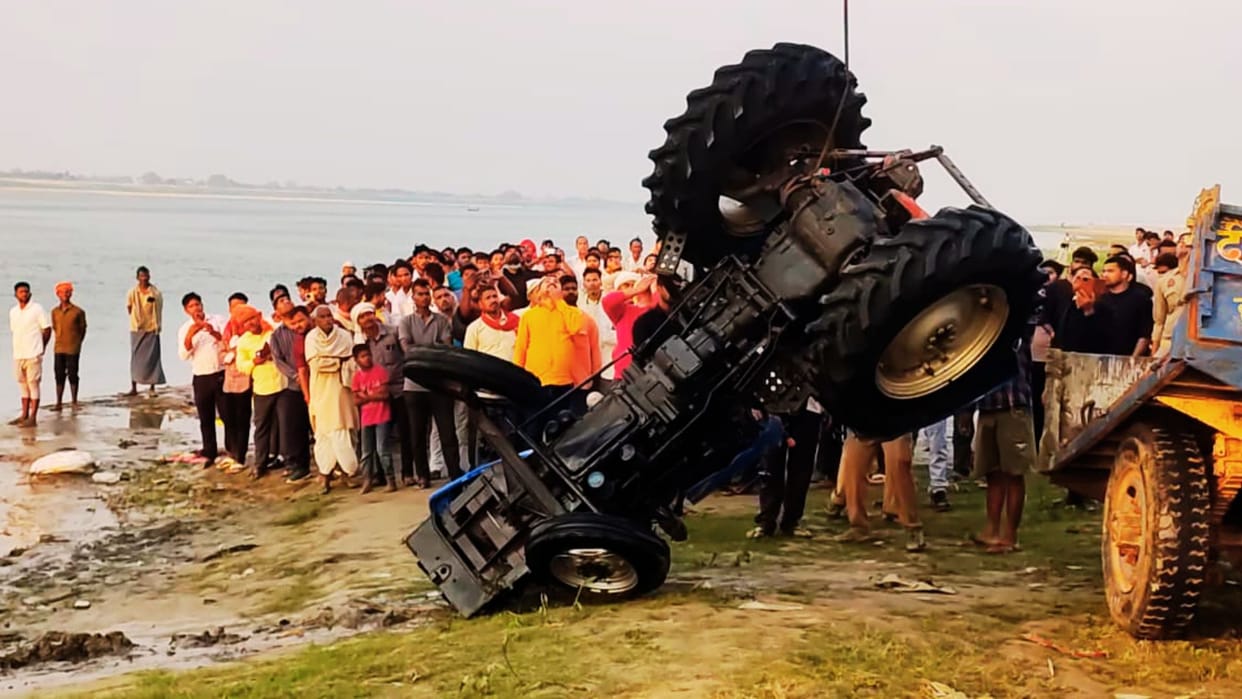 Tractor-Trolley Plunges into Ganges After Breaking Through Railing Retrieved After 19 Hours Two Missing