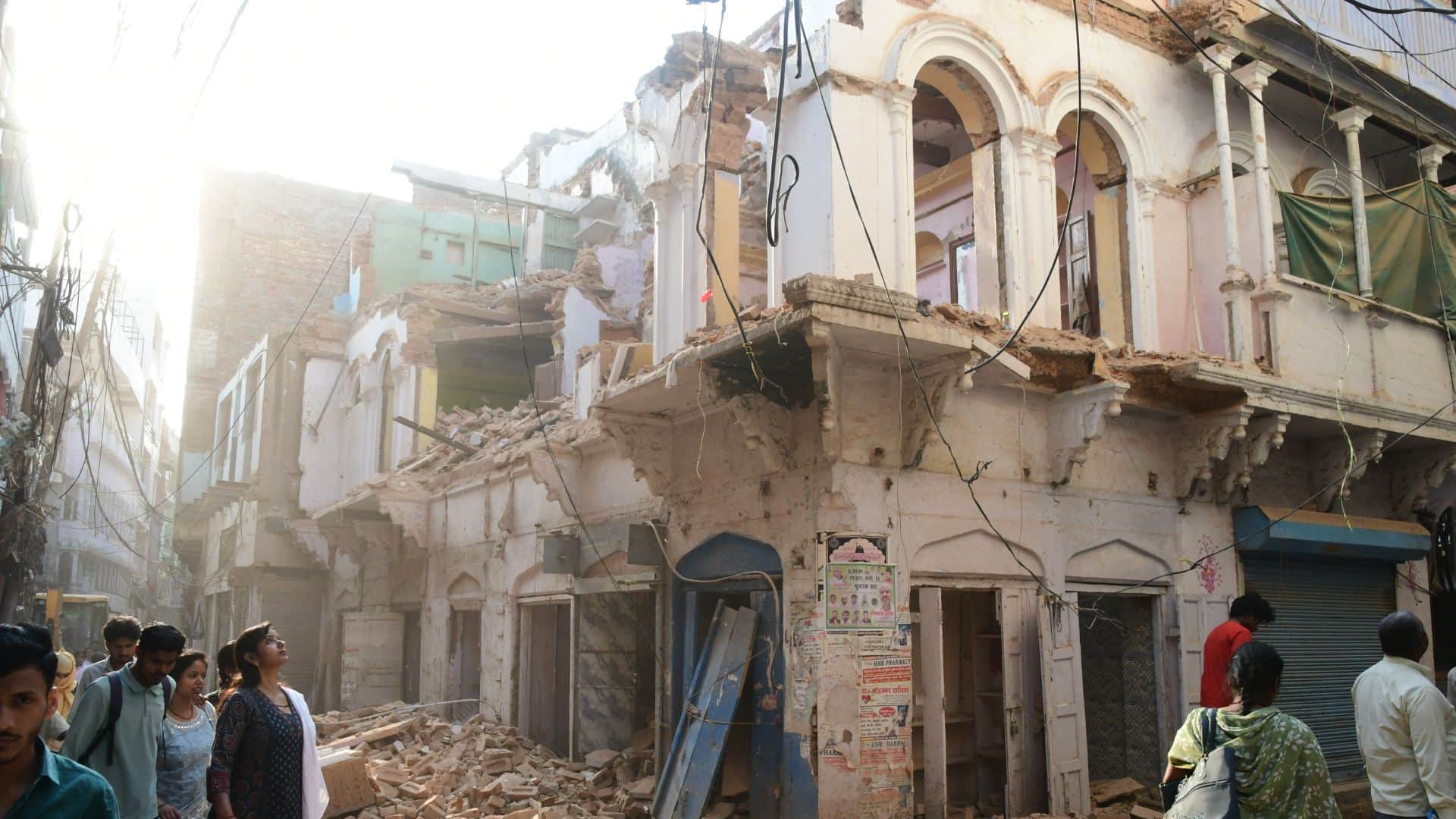 Buildings in Dal Mandi demolished using bulldozers chisels and hammers in varanasi