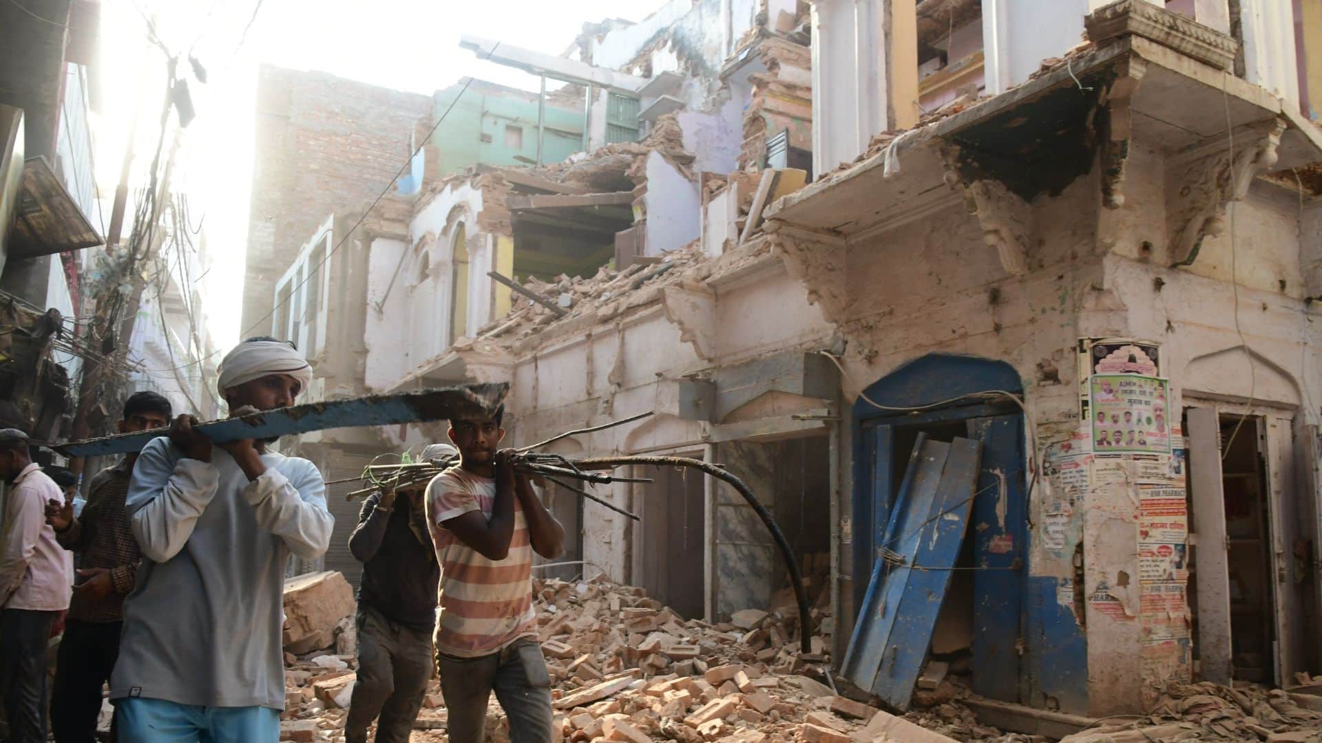 Buildings in Dal Mandi demolished using bulldozers chisels and hammers in varanasi