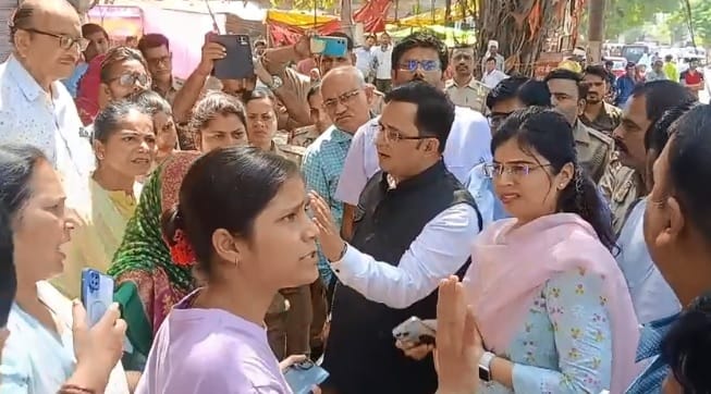 Kanpur Tension at Pink Building following heated argument residents stand firm in protest against liquor shop