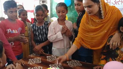 Children read newspapers in schools during the new academic session