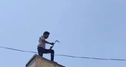 Man Climbs Roof With Sickle Causes Panic in Ading Market Rescued by Police