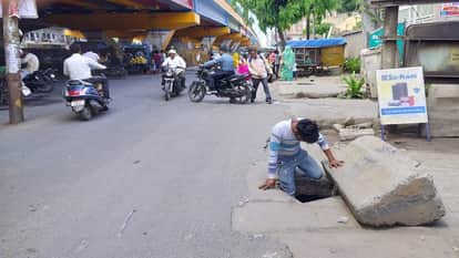 Man Falls into Open Manhole While Using Phone; Narrow Escape Sparks Safety Concerns