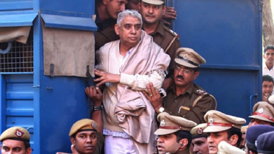 Dressed in a white kurta-pajama and branded shoes, Rampal walked out of jail; the sentry offered a salute