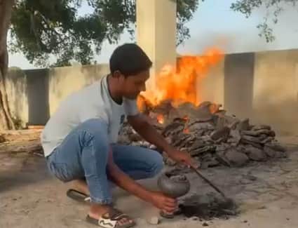 Lighting Hookah with Fire from Burning Funeral Pyre in hapur