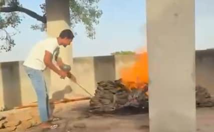 Lighting Hookah with Fire from Burning Funeral Pyre in hapur