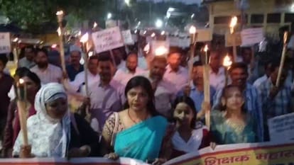 Teachers protest against the mandatory TET requirement torchlight processions held in Bareilly