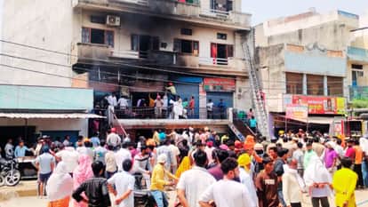 Fire Breaks Out in Building Tenants Rush Rooftop Help Fire Brigade Arrives one Hour Later Out of Water