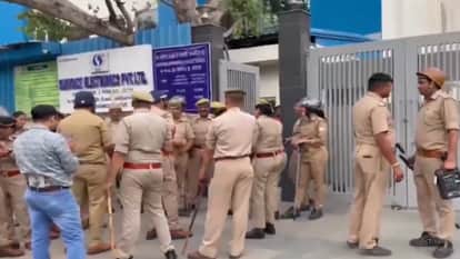 Workers protest outside a private company in Sector 8