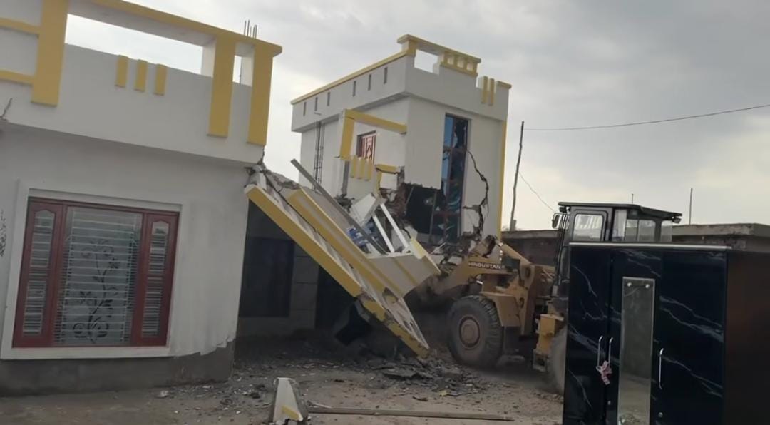 Bulldozer runs on jailed smuggler's property, illegal house demolished in Belicharana