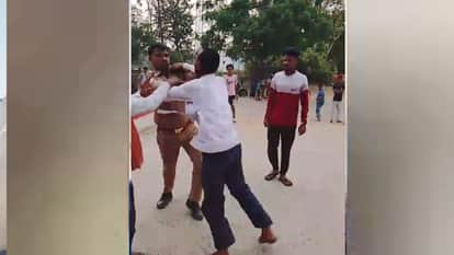 In Maharajganj, a head constable beat up a rickshaw driver after throwing him on the road.