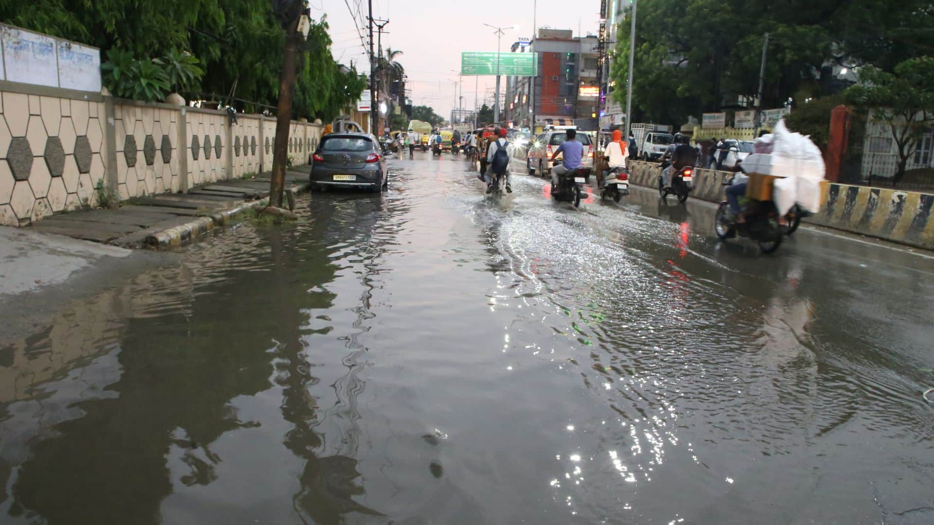 Trees Toppled Varanasi Signboards Blown Away Power Outages Several Areas People Take Shelter Balconies