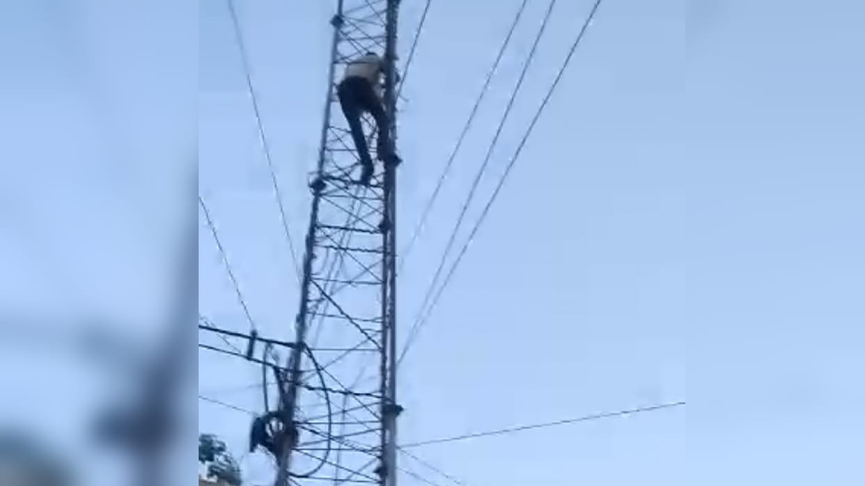 Upset over suspension, junior engineer of electricity department climbs mobile tower, causing panic in the dep
