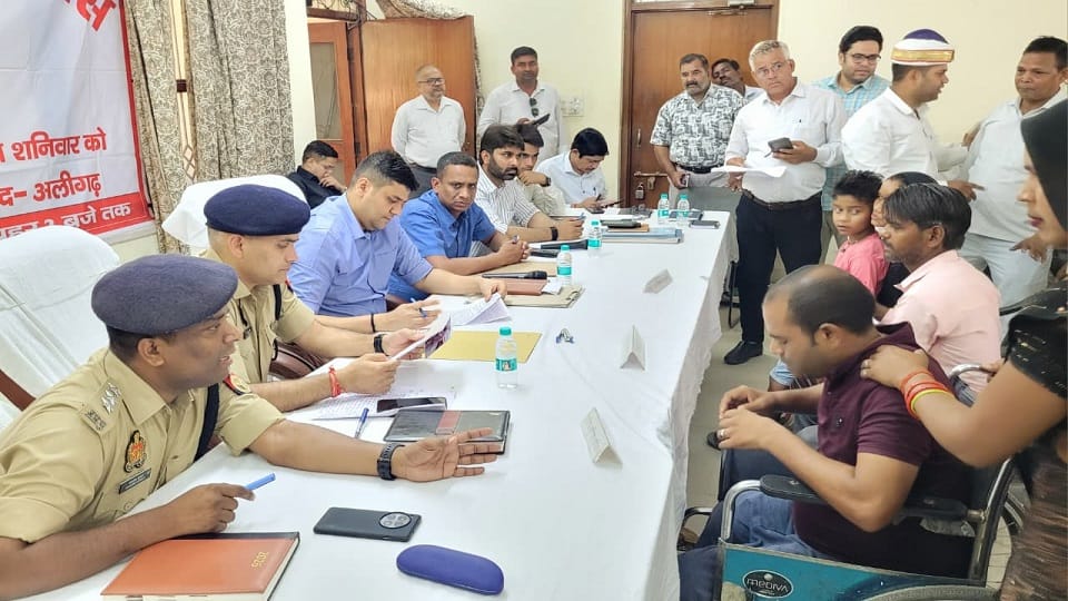 Aligarh DM listened to the complaint while sitting on a chair