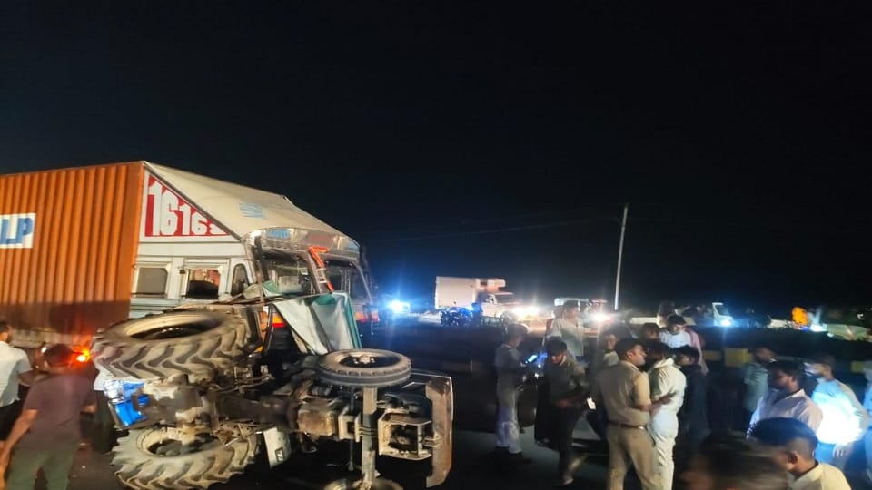 Tractor Overturns After Collision with Container Three Injured
