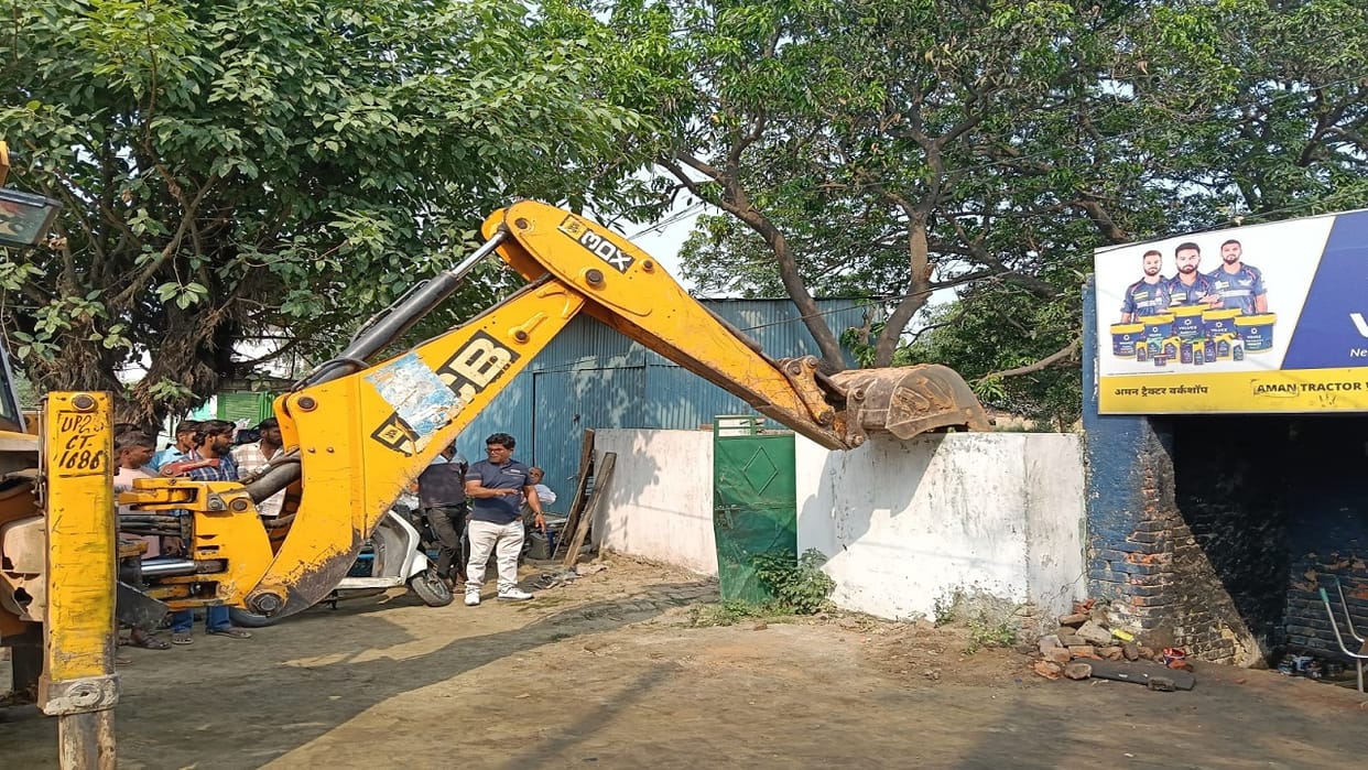 Encroachments Cleared from Cremation Ground Route Bulldozer Demolishes Shrine Wall in Bareilly