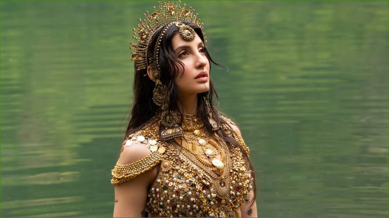 Nora Fatehi Shares her stunning photos looking like water goddess In Indian asthetic using the gold Jewellery