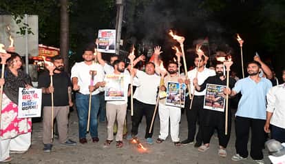 Youth Congress workers took out a torchlight procession to protest against the NEET paper leak