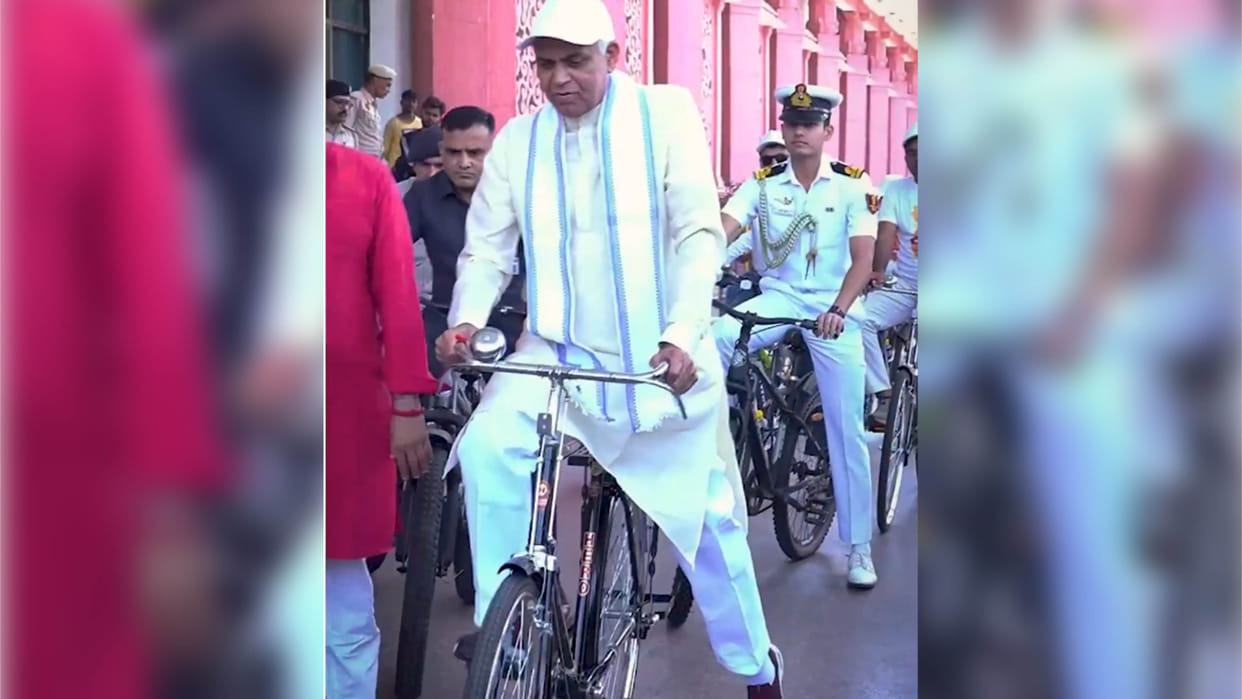 Gujarat Governor Acharya Devvrat cycles to Gurukul after train journey urges fuel conservation