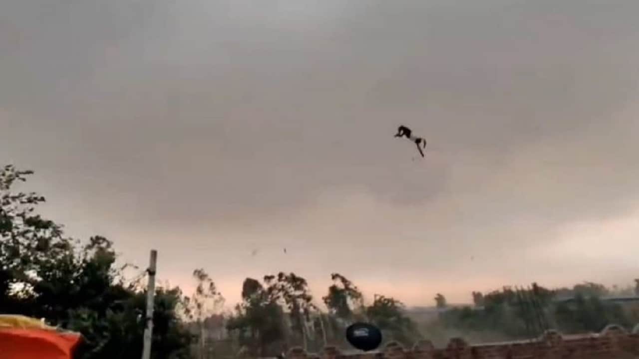 bareilly viral video man flying with tin shed in storm