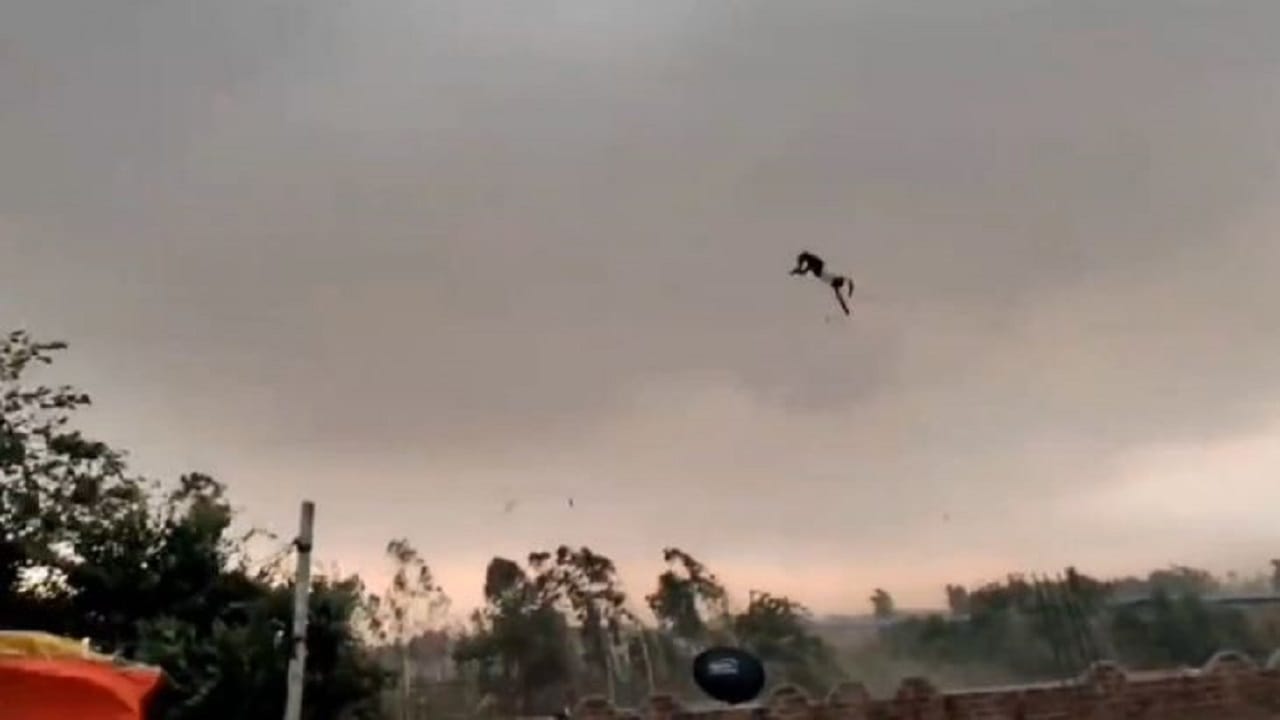 bareilly viral video man flying with tin shed in storm