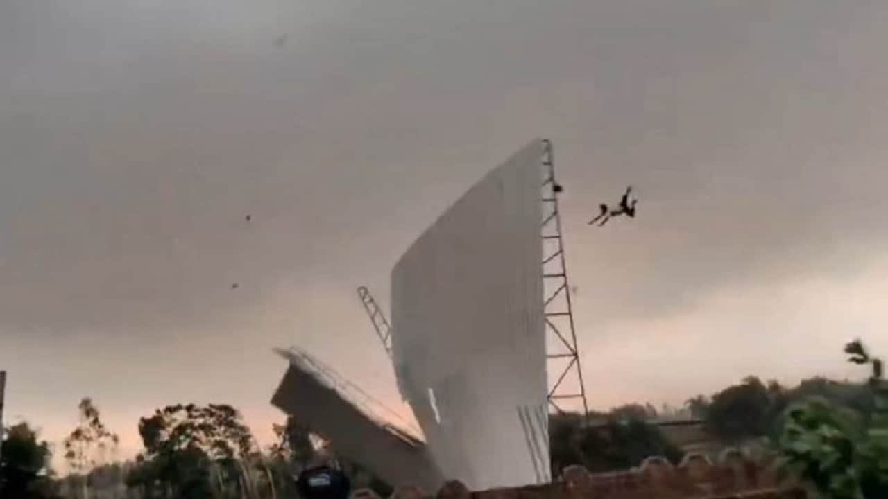 bareilly viral video man flying with tin shed in storm