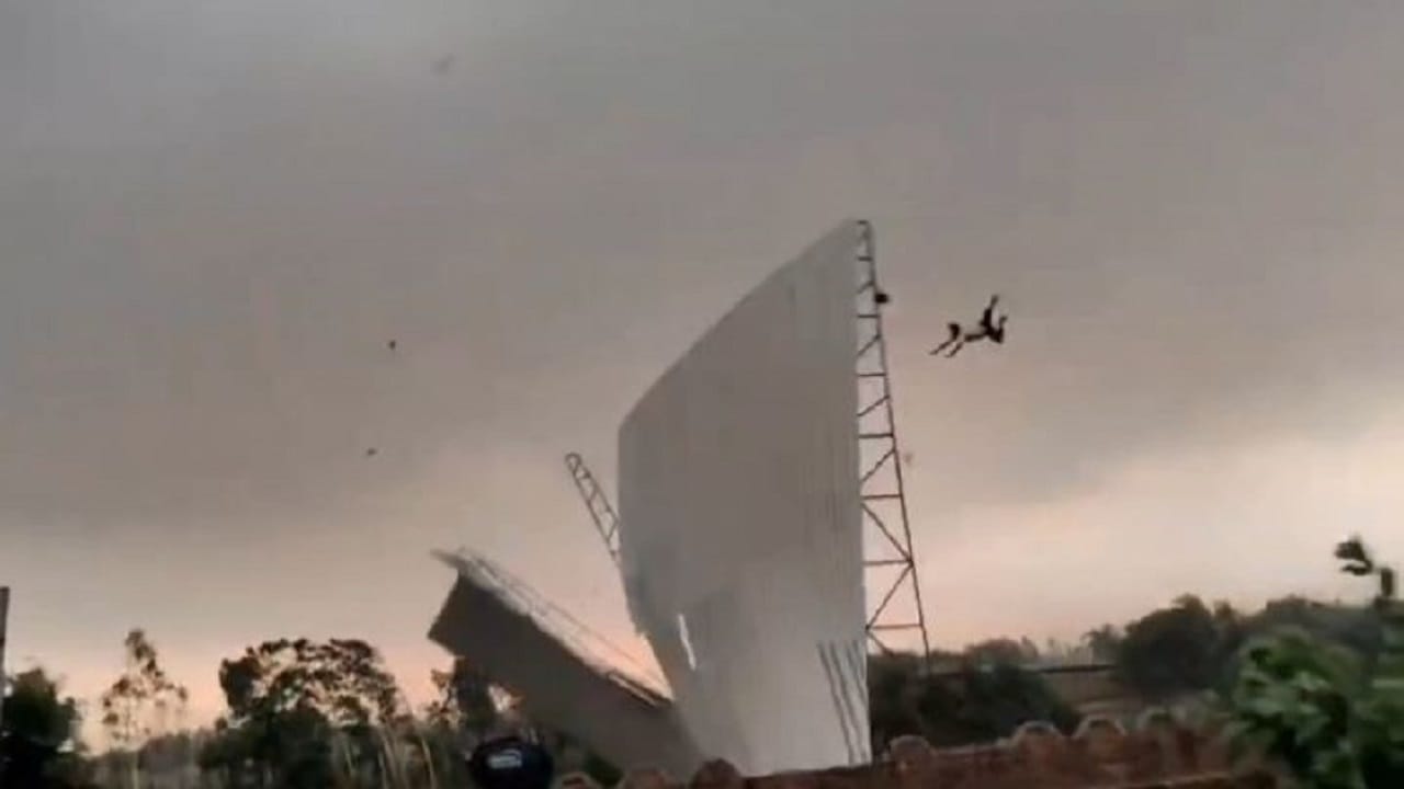bareilly viral video man flying with tin shed in storm