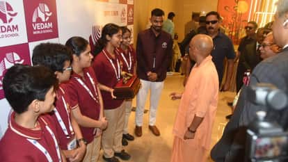 Amar Ujala Samvad 2026 Students from Vedam World School Meet CM Yogi Welcome Him by Presenting Peacock Emblem