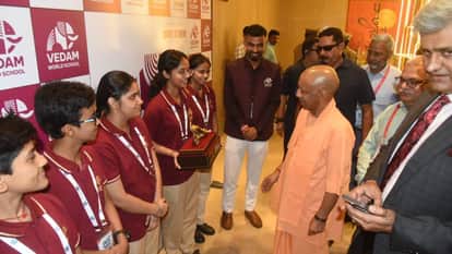 Amar Ujala Samvad 2026 Students from Vedam World School Meet CM Yogi Welcome Him by Presenting Peacock Emblem