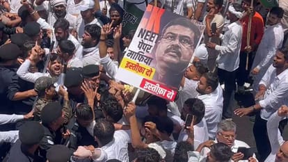 neet paper leak jaipur congress protest bjp headquarters gherao water cannon dharmendra pradhan resignation