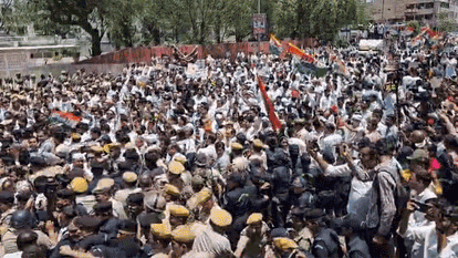 neet paper leak jaipur congress protest bjp headquarters gherao water cannon dharmendra pradhan resignation