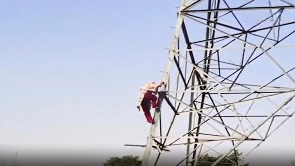 young woman adamant about marrying her lover climbed atop high-tension power line tower in agra