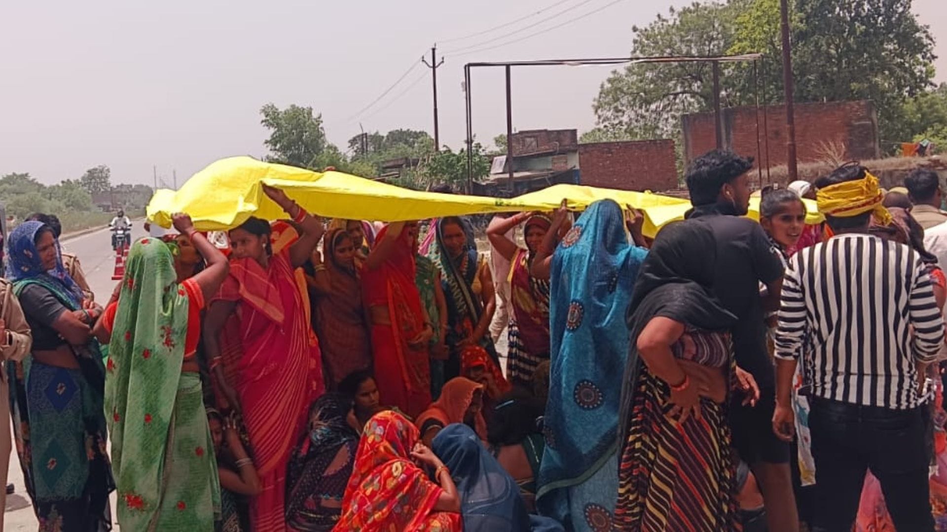 Biker killed after struck BJP stickered Scorpio road blockade ensues villagers stage protest in jaunpur