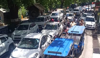 tourist season traffic jam mall road vehicle congestion