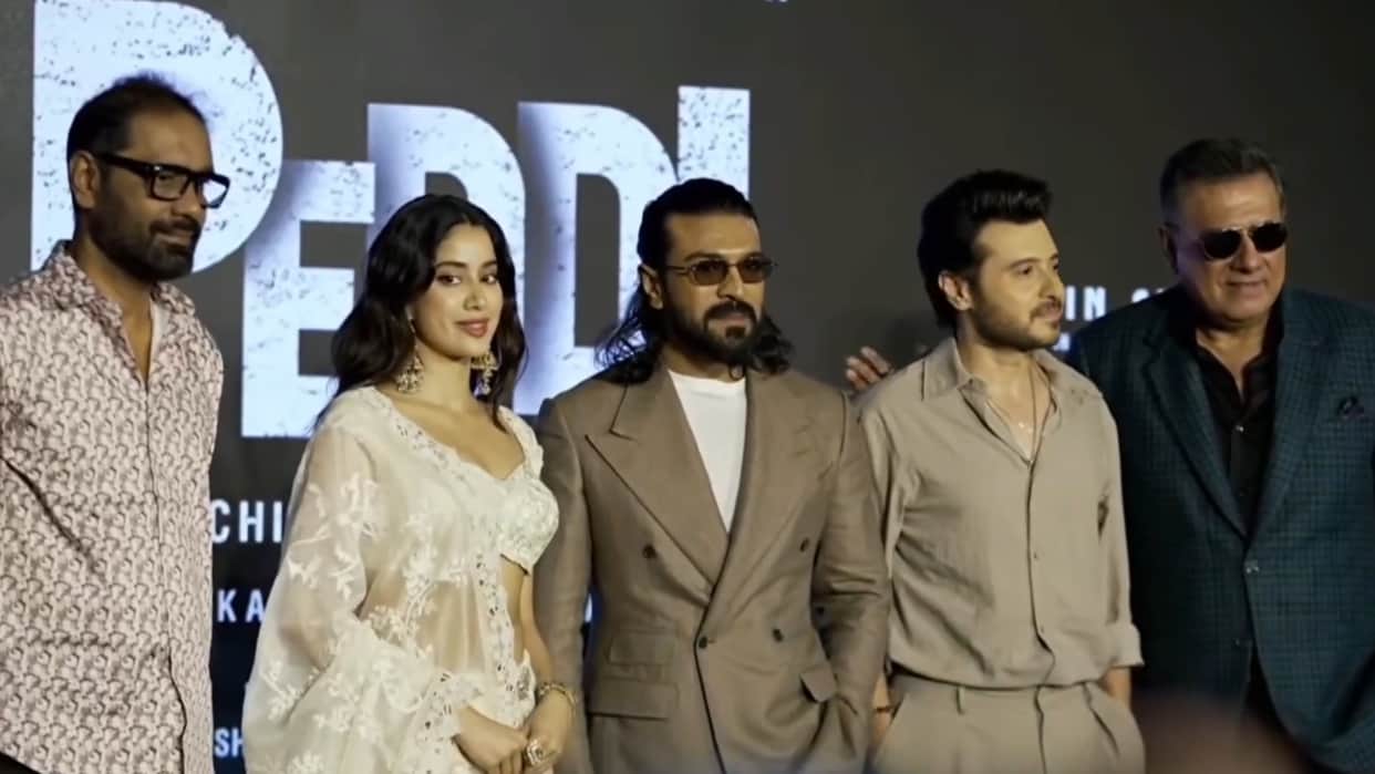 Peddi Delhi Press Conference Attend By Ram Charan Janhvi Kapoor  Divyenndu And Boman Irani