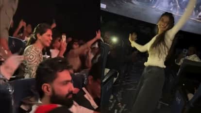 fans celebrate Peddi Screening Upasana Kamineni Konidela showers confetti at Ram Charan entry