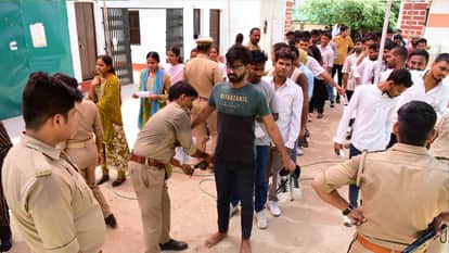 UP Police recruitment exam Impostor arrested after showing up to take test in place of his cousin in varanasi